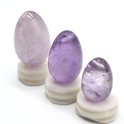 OEM aceita ovos de Yoni esculpidos para exercício vaginal ovos de jade de ametista natural perfurado