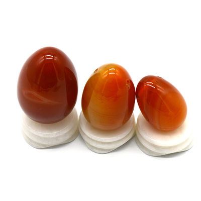 OEM ODM aceito Carnelian vermelho Yoni ovos de pedra semi preciosa ovos perfurados estilo de massagem