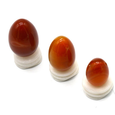 OEM ODM aceito Carnelian vermelho Yoni ovos de pedra semi preciosa ovos perfurados estilo de massagem