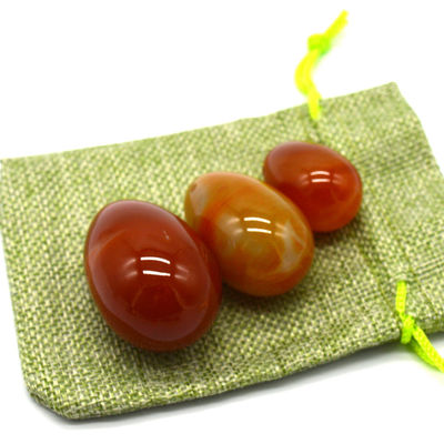 OEM ODM aceito Carnelian vermelho Yoni ovos de pedra semi preciosa ovos perfurados estilo de massagem
