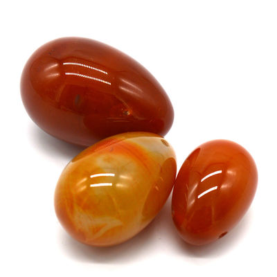 OEM ODM aceito Carnelian vermelho Yoni ovos de pedra semi preciosa ovos perfurados estilo de massagem