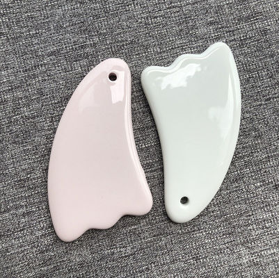2024 Design Multi Função Cerâmica única Guasha raspando corpo facial Gua Sha massagista para rejuvenescimento do rosto e do corpo