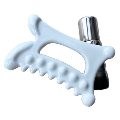 Experimente os benefícios da drenagem linfática com a nossa ferramenta de massagem em cerâmica Gua Sha.