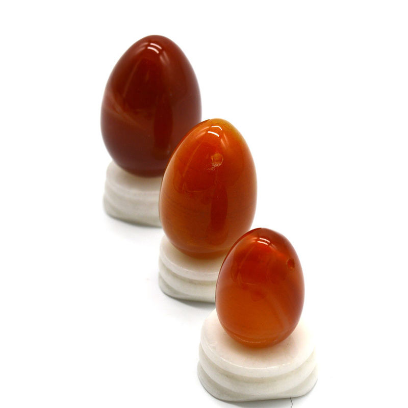 OEM ODM aceito Carnelian vermelho Yoni ovos de pedra semi preciosa ovos perfurados estilo de massagem